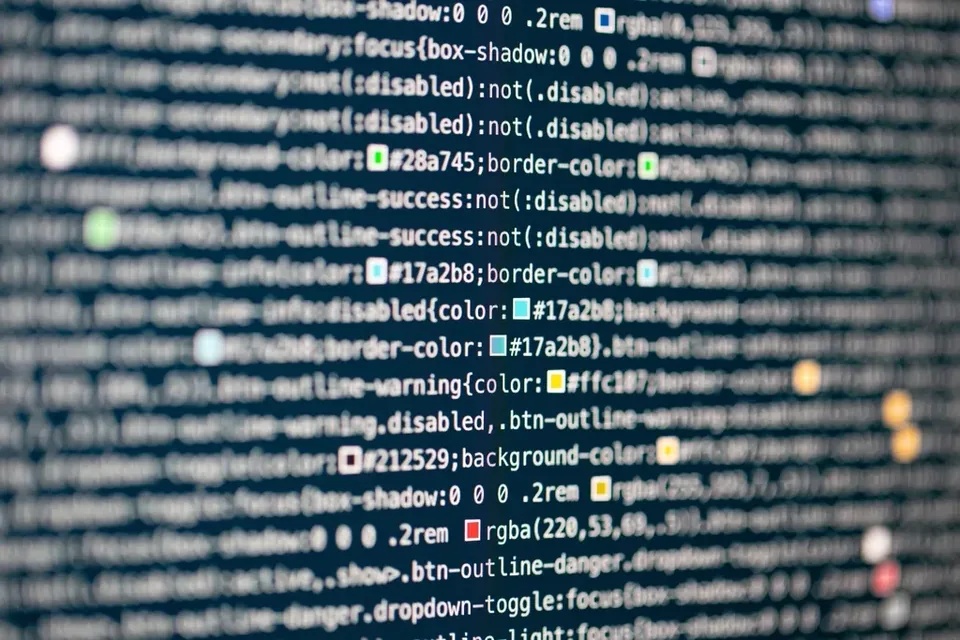 Close-up of a screen full of web stylesheet code, with small coloured swatches beside the colour values