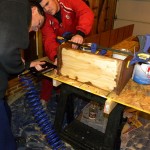 Attaching the base of the DVD shelf
